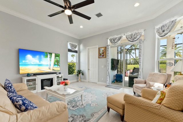 9129 SW Pepoli Way, Port Saint Lucie, FL 34987 - living room featuring crown molding, recessed lighting, ceiling fan, baseboards, and a glass covered fireplace