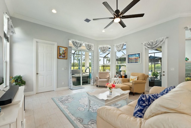 9129 SW Pepoli Way, Port Saint Lucie, FL 34987 - living room with healthy amount of natural light, ceiling fan, recessed lighting, crown molding, and baseboards