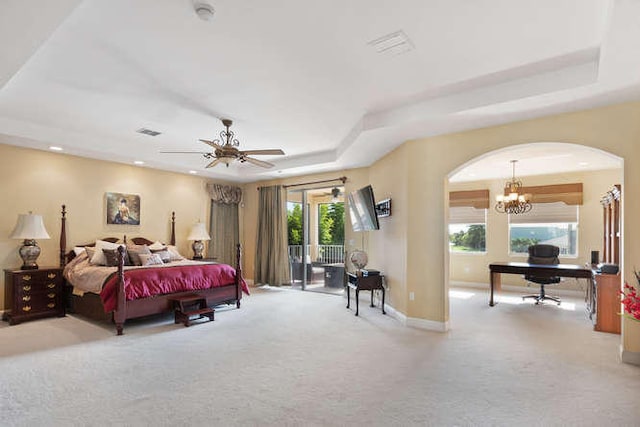 2646 Treanor Ter, Wellington, FL 33414 - bedroom featuring arched walkways, light carpet, a raised ceiling, and baseboards