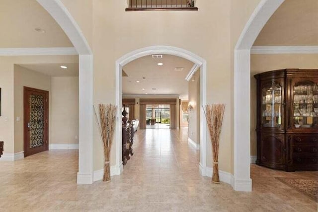 2646 Treanor Ter, Wellington, FL 33414 - corridor featuring a high ceiling, baseboards, and ornamental molding