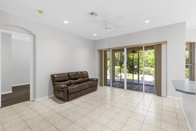 living area with recessed lighting, a ceiling fan, visible vents, and light tile patterned flooring