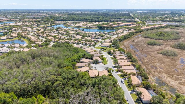 bird's eye view with a residential view and a water view