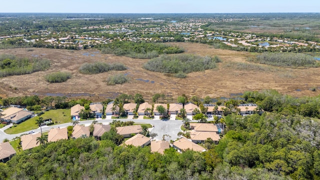 drone / aerial view with a residential view and a water view