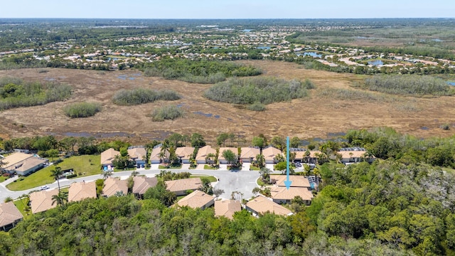 birds eye view of property with a residential view and a water view