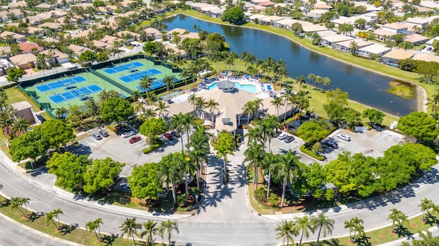 birds eye view of property featuring a residential view and a water view