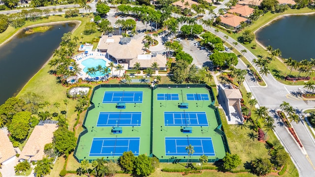 birds eye view of property with a water view