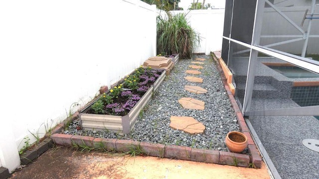 view of yard featuring a garden and fence