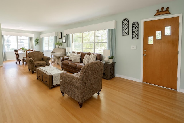 2076 E Main St, Pahokee, FL 33476 - living area with light wood-type flooring and baseboards