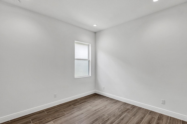 10064 Driftwood Way, Palm Beach Gardens, FL 33412 - spare room with dark wood-style flooring, baseboards, and recessed lighting
