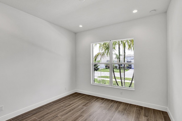 10064 Driftwood Way, Palm Beach Gardens, FL 33412 - spare room with healthy amount of natural light, dark wood finished floors, baseboards, and recessed lighting