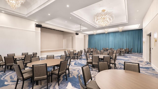 dining space featuring carpet flooring, recessed lighting, an inviting chandelier, and a raised ceiling
