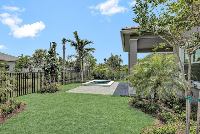10064 Driftwood Way, Palm Beach Gardens, FL 33412 - view of yard with an outdoor hot tub and a patio area