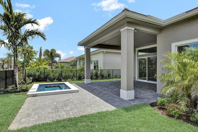 10064 Driftwood Way, Palm Beach Gardens, FL 33412 - view of pool with a hot tub and a patio area