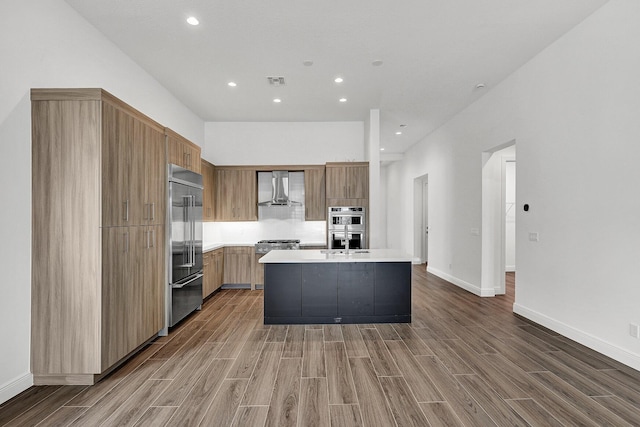 10064 Driftwood Way, Palm Beach Gardens, FL 33412 - kitchen with wall chimney exhaust hood, modern cabinets, appliances with stainless steel finishes, wood finished floors, and recessed lighting