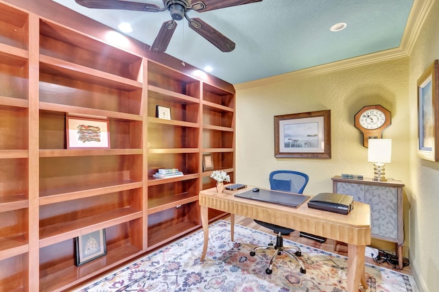 home office featuring crown molding, a textured wall, and ceiling fan