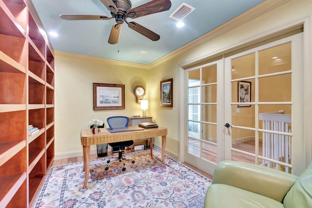 office space with visible vents, ceiling fan, ornamental molding, french doors, and wood finished floors