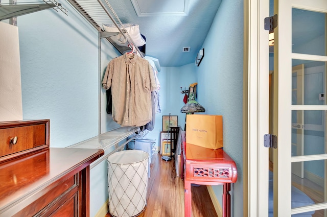 interior space featuring visible vents and wood finished floors