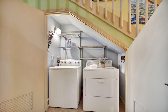 laundry area with laundry area and washing machine and dryer
