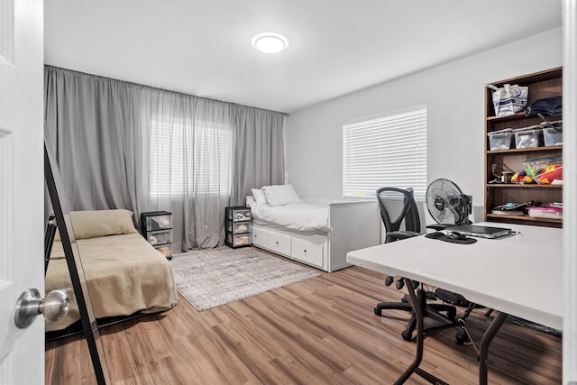 bedroom featuring wood finished floors