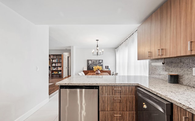 kitchen with dishwasher, a chandelier, a peninsula, refrigerator, and light stone counters
