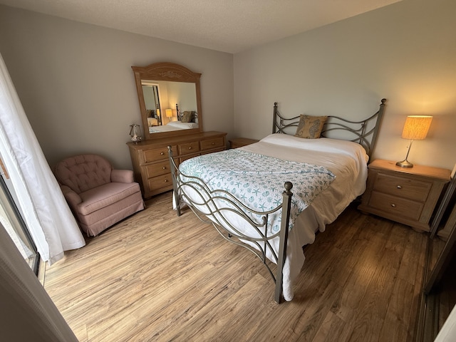 9407 S Ocean Dr Unit 1D, Jensen Beach, FL 34957 - bedroom with light wood finished floors