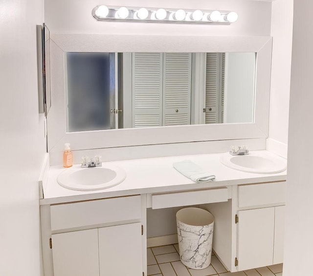 9407 S Ocean Dr Unit 1D, Jensen Beach, FL 34957 - full bathroom featuring double vanity, tile patterned flooring, and a closet