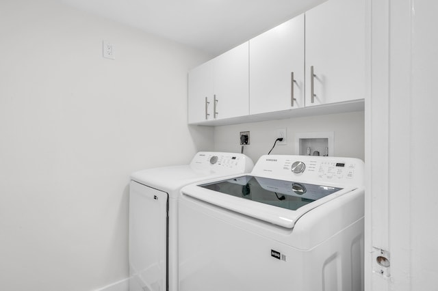 laundry area with cabinet space and washer and clothes dryer