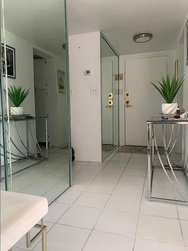 3113 S Ocean Dr Unit 301, Hallandale Beach, FL 33009 - corridor with light tile patterned floors