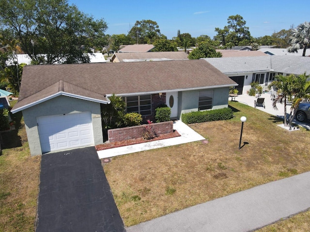 4475 Pine Park Cir, Lake Worth, FL 33467 - single story home with stucco siding, a front lawn, driveway, roof with shingles, and an attached garage