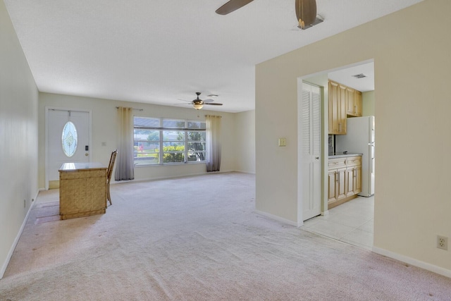 4475 Pine Park Cir, Lake Worth, FL 33467 - unfurnished living room featuring baseboards, light carpet, and a ceiling fan