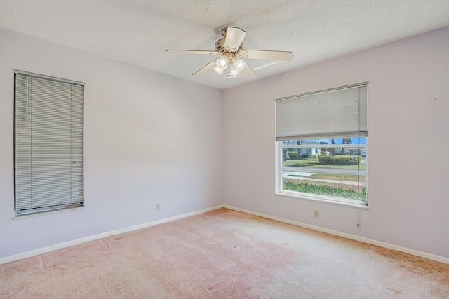 4475 Pine Park Cir, Lake Worth, FL 33467 - carpeted empty room with baseboards, a textured ceiling, and ceiling fan