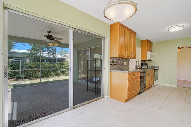 4475 Pine Park Cir, Lake Worth, FL 33467 - kitchen featuring white microwave, a sink, ceiling fan, electric stove, and dishwasher