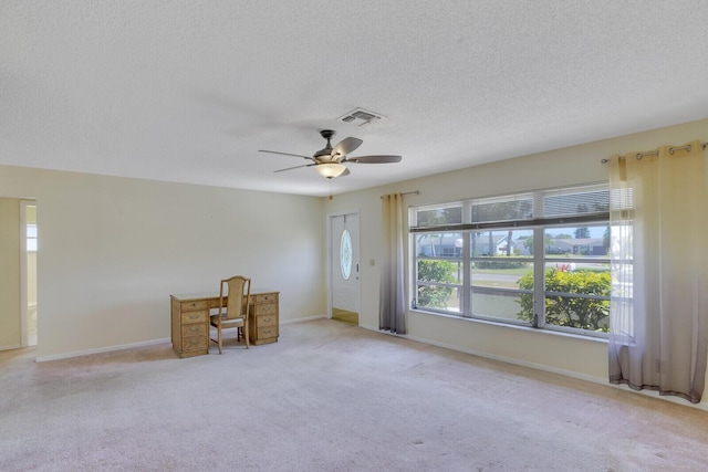 4475 Pine Park Cir, Lake Worth, FL 33467 - unfurnished room featuring visible vents, carpet floors, a textured ceiling, and a ceiling fan