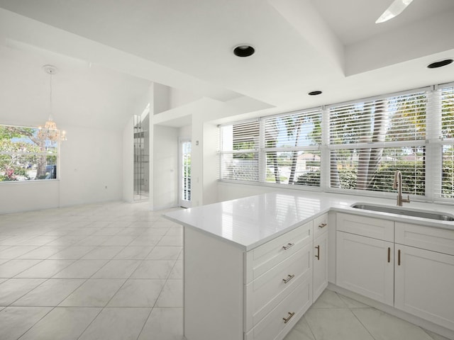 3642 SW Sunset Trace Cir, Palm City, FL 34990 - kitchen with a wealth of natural light, a chandelier, and a sink