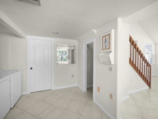 3642 SW Sunset Trace Cir, Palm City, FL 34990 - interior space with light tile patterned flooring, washer and dryer, stairs, and a healthy amount of sunlight