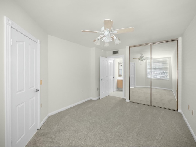 3642 SW Sunset Trace Cir, Palm City, FL 34990 - unfurnished bedroom featuring visible vents, baseboards, carpet, and a closet