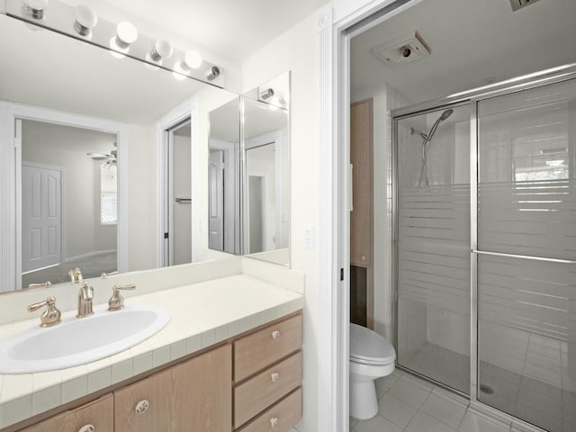 3642 SW Sunset Trace Cir, Palm City, FL 34990 - bathroom with tile patterned flooring, a shower stall, toilet, and vanity