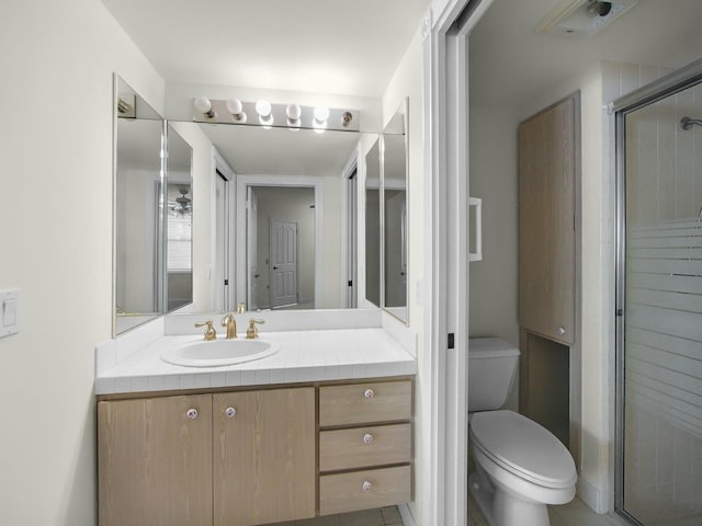 3642 SW Sunset Trace Cir, Palm City, FL 34990 - bathroom featuring vanity, a shower stall, and toilet