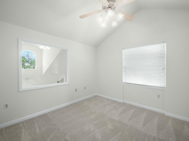 3642 SW Sunset Trace Cir, Palm City, FL 34990 - empty room with baseboards, ceiling fan, carpet flooring, and vaulted ceiling