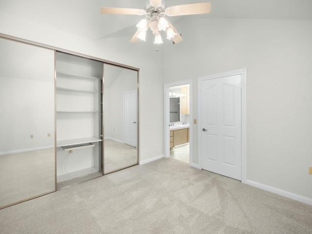 3642 SW Sunset Trace Cir, Palm City, FL 34990 - unfurnished bedroom featuring lofted ceiling, ensuite bathroom, carpet floors, baseboards, and ceiling fan