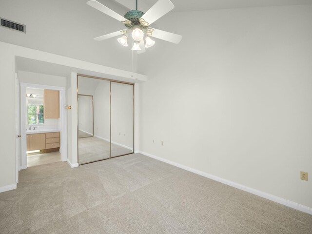 3642 SW Sunset Trace Cir, Palm City, FL 34990 - unfurnished bedroom with a ceiling fan, visible vents, baseboards, a closet, and light colored carpet