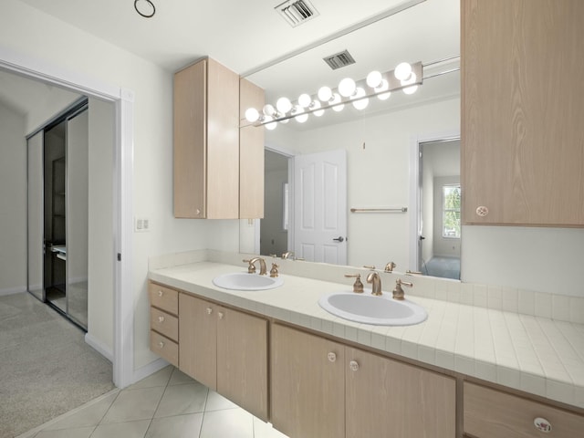 3642 SW Sunset Trace Cir, Palm City, FL 34990 - full bath featuring double vanity, visible vents, and a sink