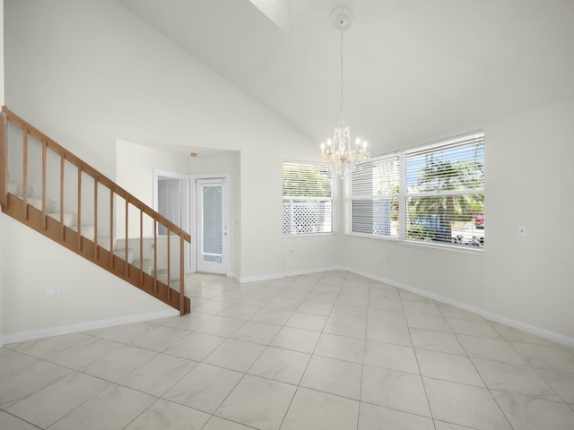 3642 SW Sunset Trace Cir, Palm City, FL 34990 - unfurnished room with stairway, a notable chandelier, baseboards, and high vaulted ceiling