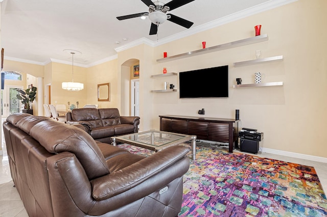 tiled living area with baseboards, arched walkways, ornamental molding, and ceiling fan with notable chandelier