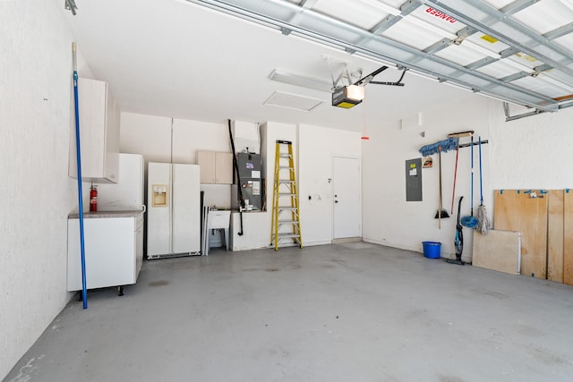 garage with electric panel, white refrigerator with ice dispenser, a garage door opener, and heating unit