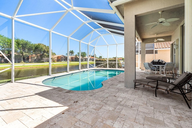 pool with a patio, a lanai, and a ceiling fan