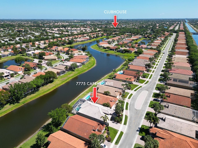 aerial view featuring a residential view and a water view