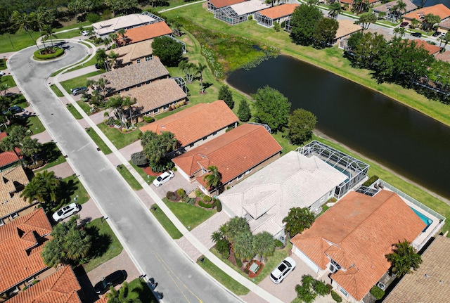 aerial view with a residential view and a water view