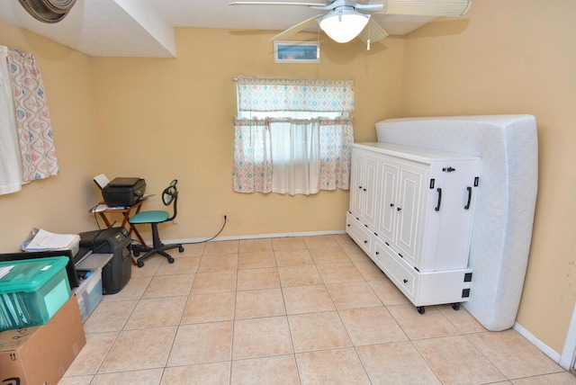 557 SE Seahouse Dr, Port Saint Lucie, FL 34983 - interior space with light tile patterned floors, baseboards, and a ceiling fan