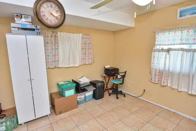 557 SE Seahouse Dr, Port Saint Lucie, FL 34983 - miscellaneous room featuring tile patterned floors, a ceiling fan, and baseboards